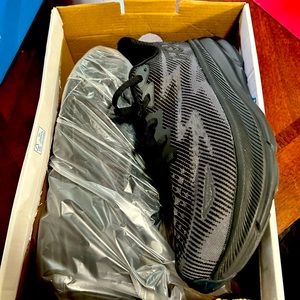 Brand new, never worn men’s 10D Clifton 9 Hoka shoes.